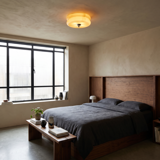 Lumeta ceiling light in a walnut and charcoal bedroom