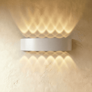 Avivah 32 cm white wall light with warm up-and-down beams on a plain wall