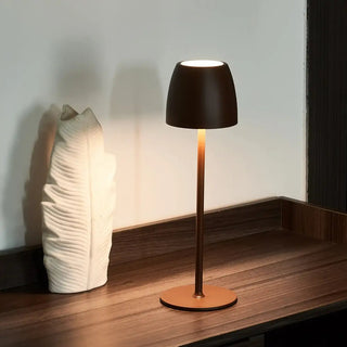 Elvarin | Brown rechargeable table lamp illuminated on a wooden surface