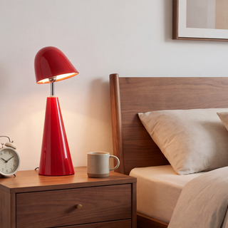 Red cone-shade table lamp in a room, scene 2